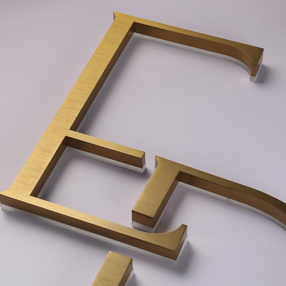 Elite Brushed Gold Titanium Halo-Lit Signs | Custom Architectural LED Signage