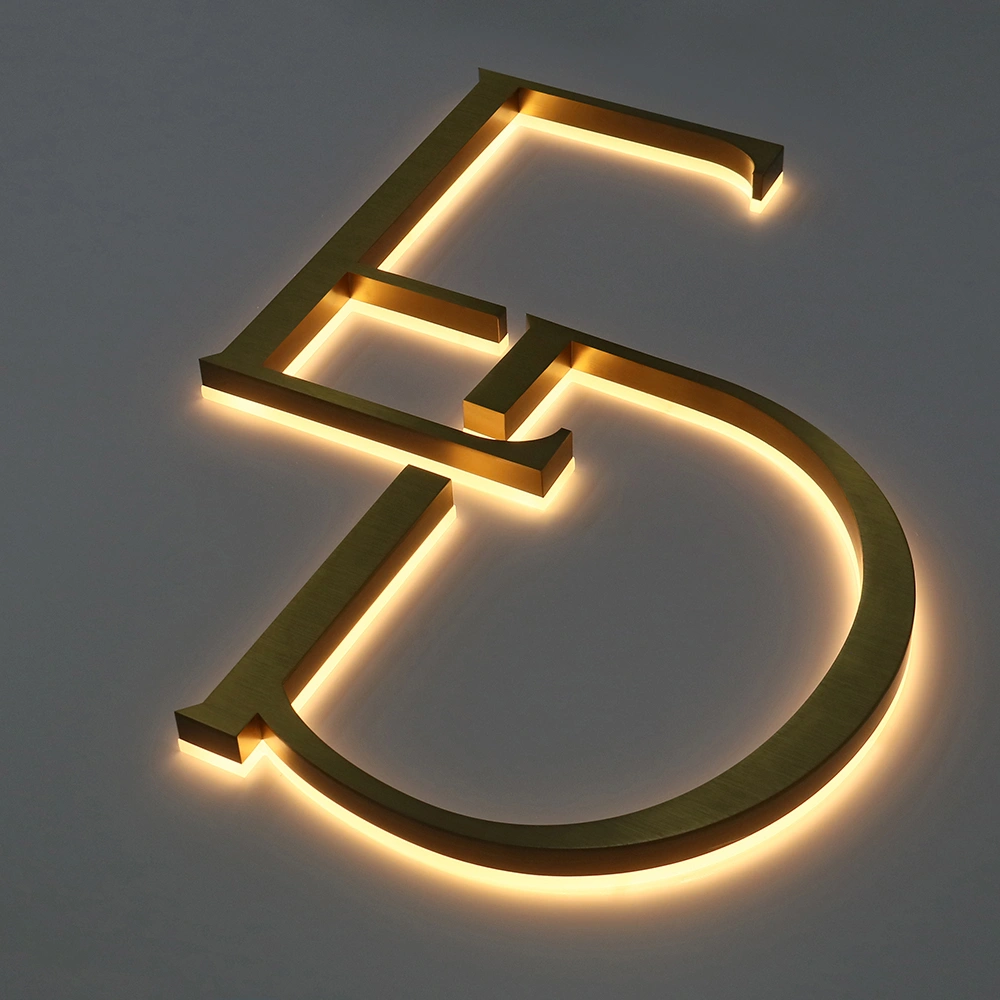 Elite Brushed Gold Titanium Halo-Lit Signs | Custom Architectural LED Signage