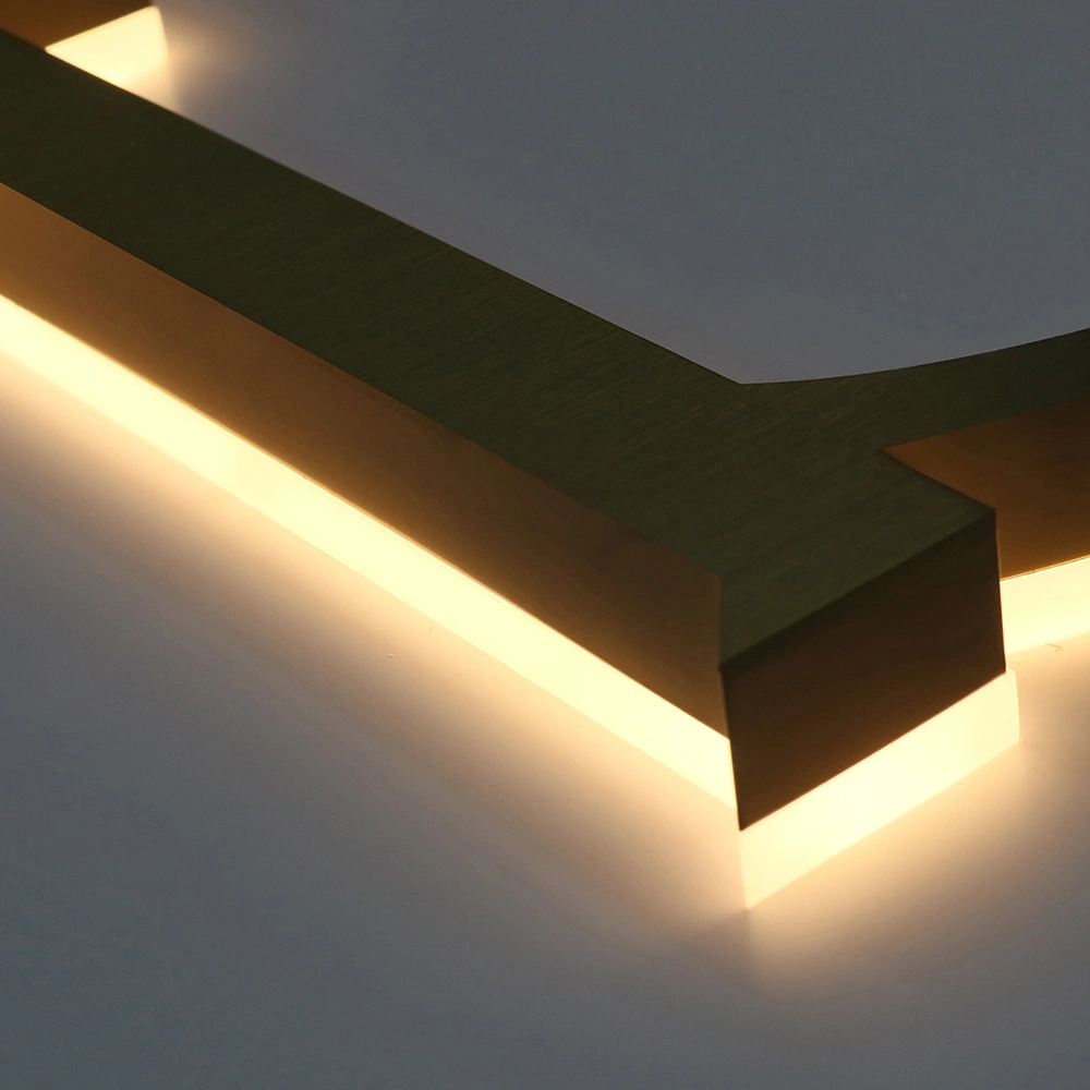 Elite Brushed Gold Titanium Halo-Lit Signs | Custom Architectural LED Signage