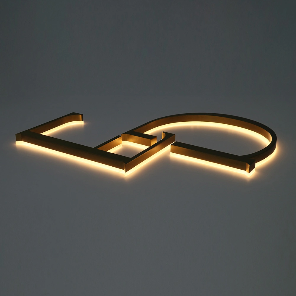 Elite Brushed Gold Titanium Halo-Lit Signs | Custom Architectural LED Signage