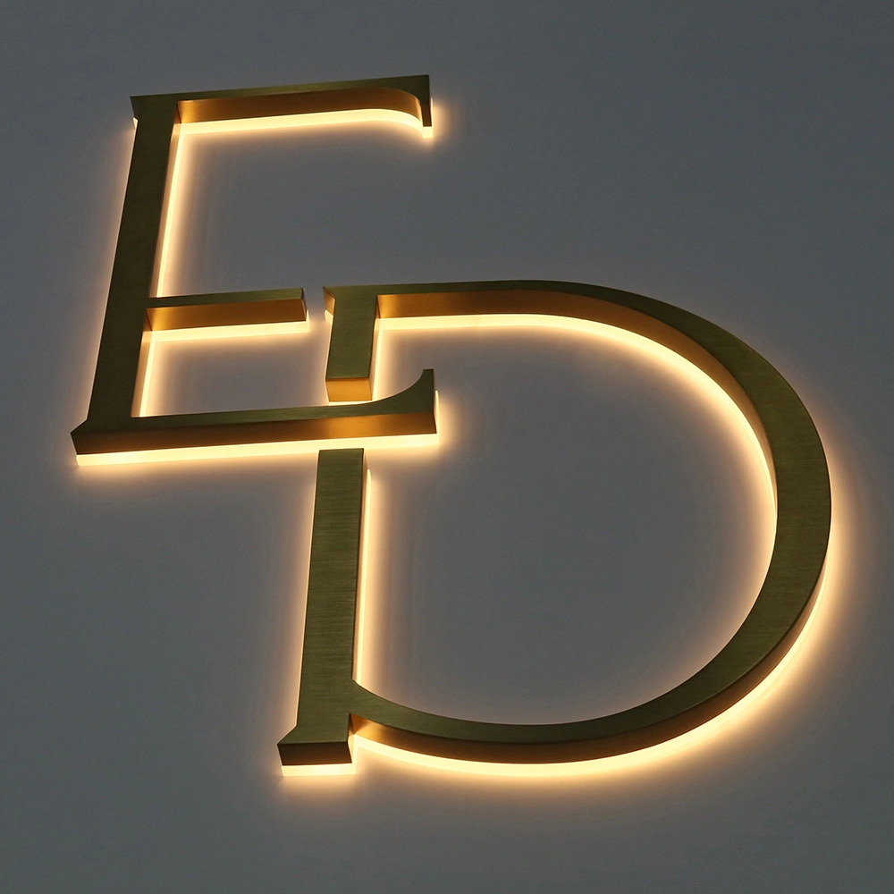 Elite Brushed Gold Titanium Halo-Lit Signs | Custom Architectural LED Signage
