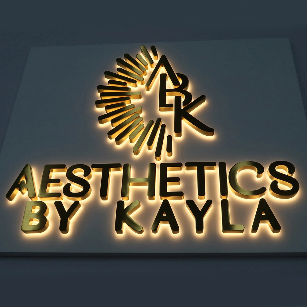 Elite Brushed Gold Titanium Halo-Lit Signs | Integrated Backplate LED Signage