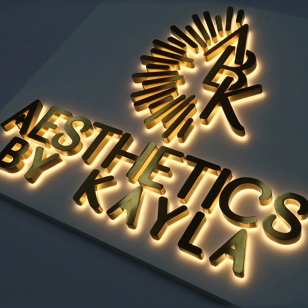 Elite Brushed Gold Titanium Halo-Lit Signs | Integrated Backplate LED Signage