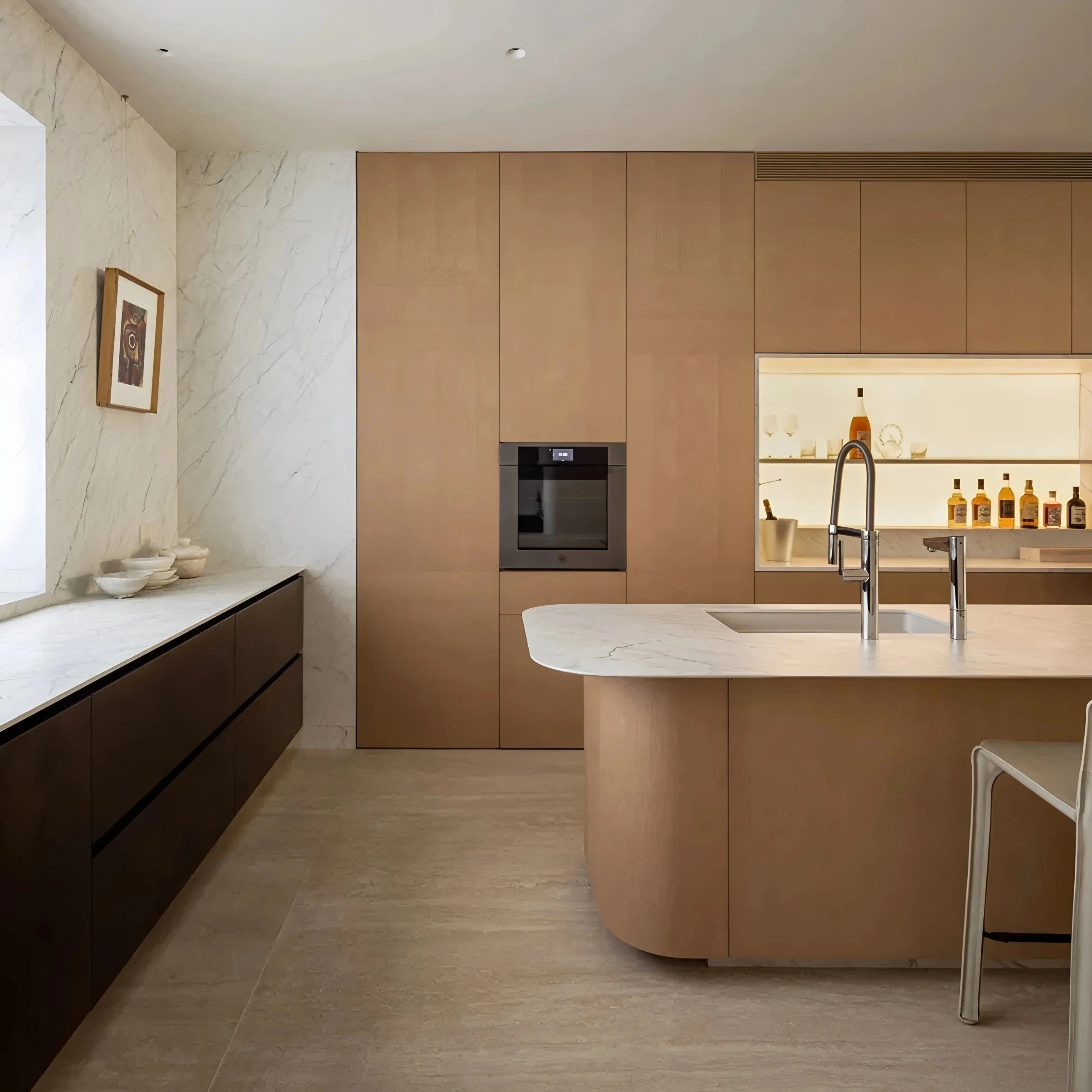 Modern Kitchen Cabinetry System with Rounded Island &amp; Integrated Backlit Bar Wall