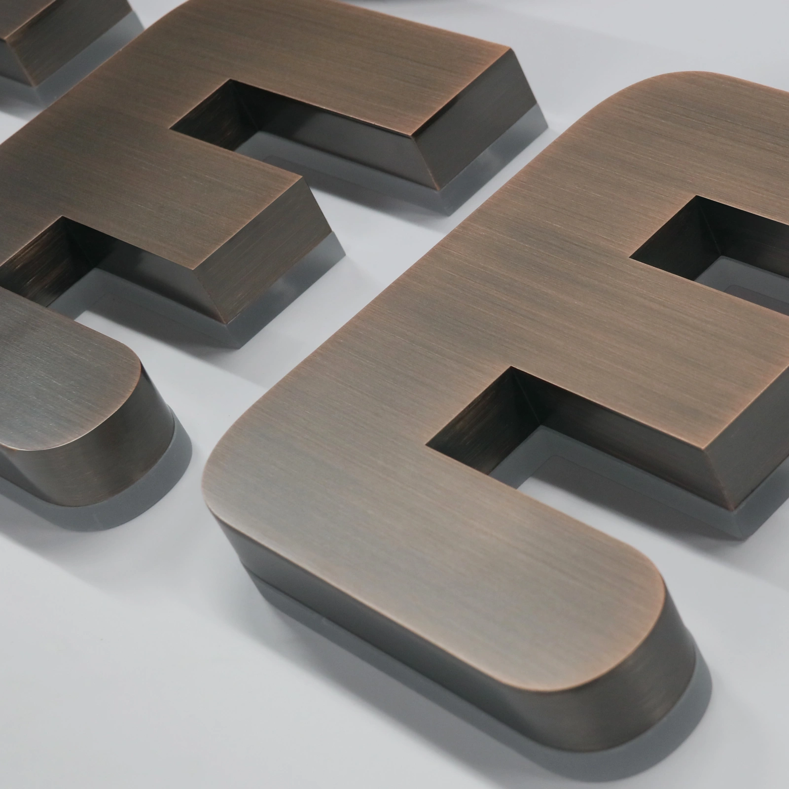 electroplated-copper-letter-macro-detail.webp