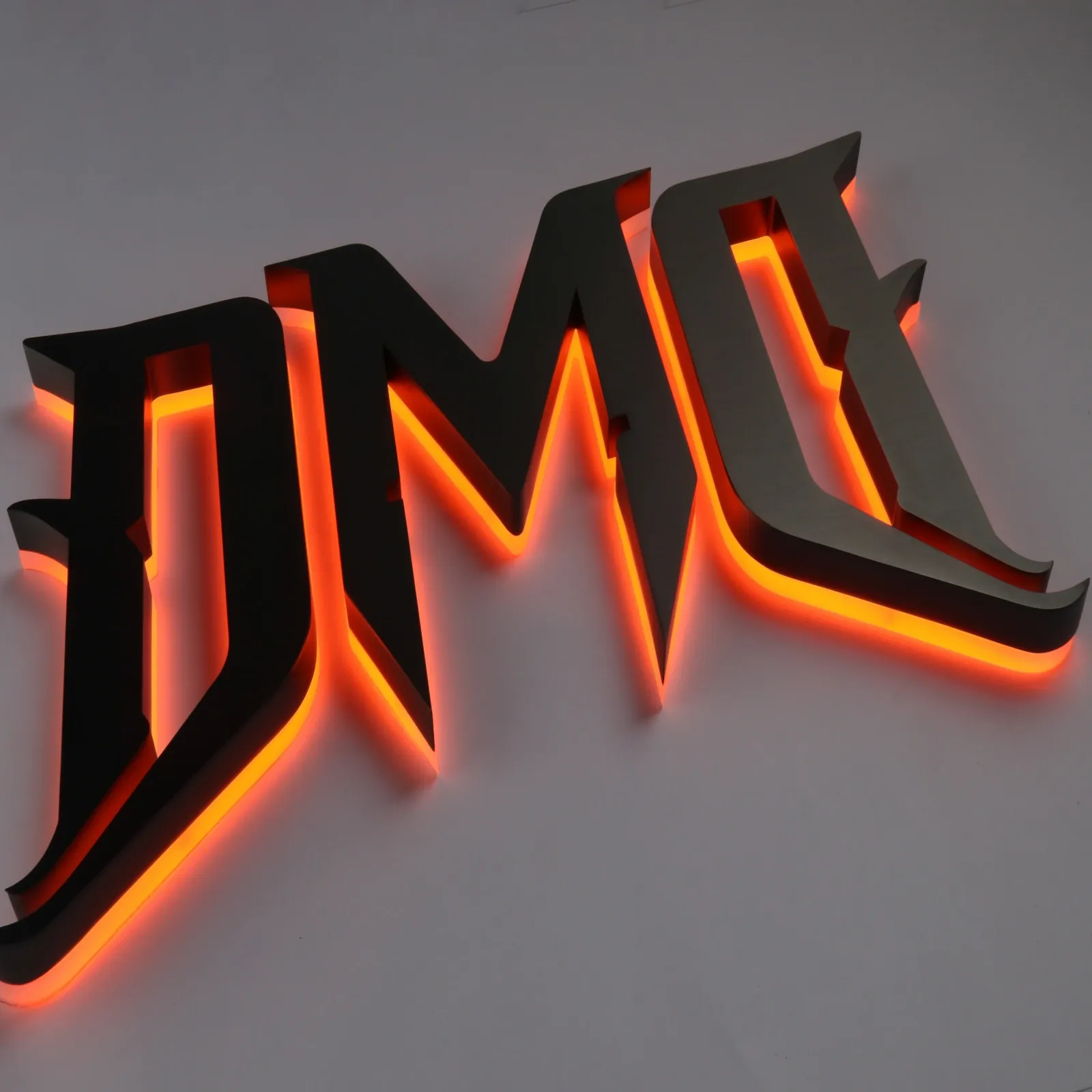 Custom Brushed Black Titanium Backlit Channel Letters (Flush Mount)