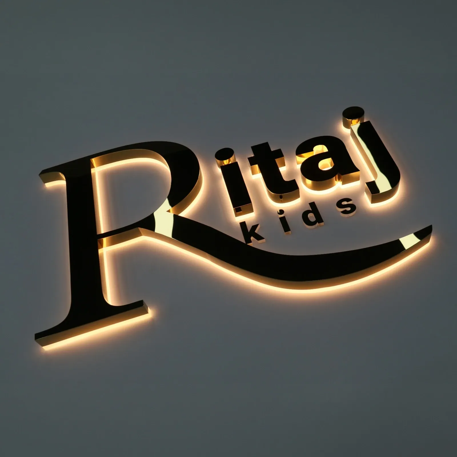 Custom Mirror Titanium Gold Backlit Channel Letters | Halo Lit Stainless Steel Sign