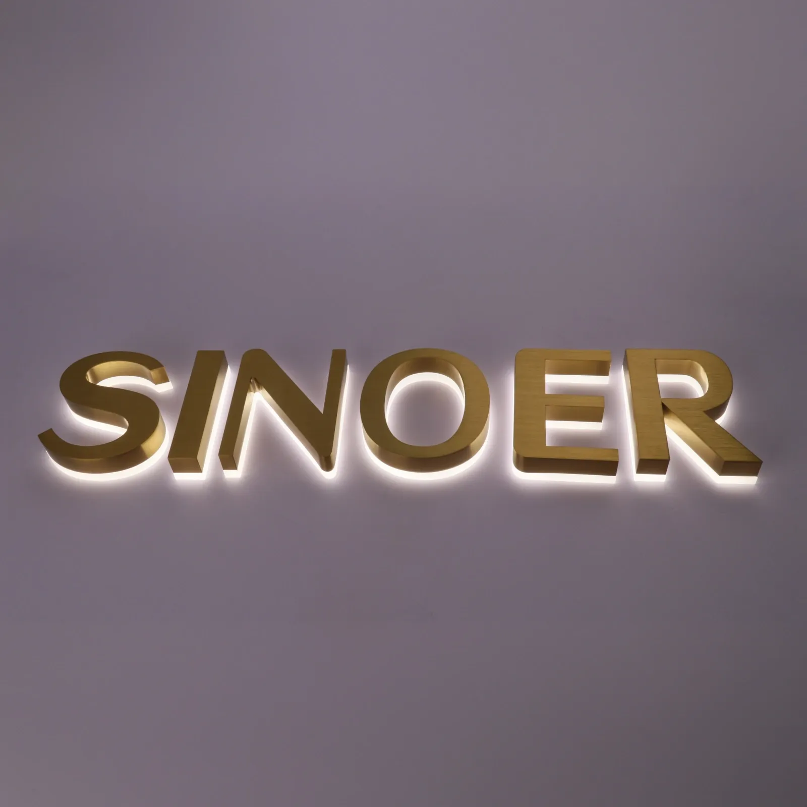 Custom Brushed Titanium Gold Backlit Channel Letters — PVD Halo Lit Stainless Steel Sign