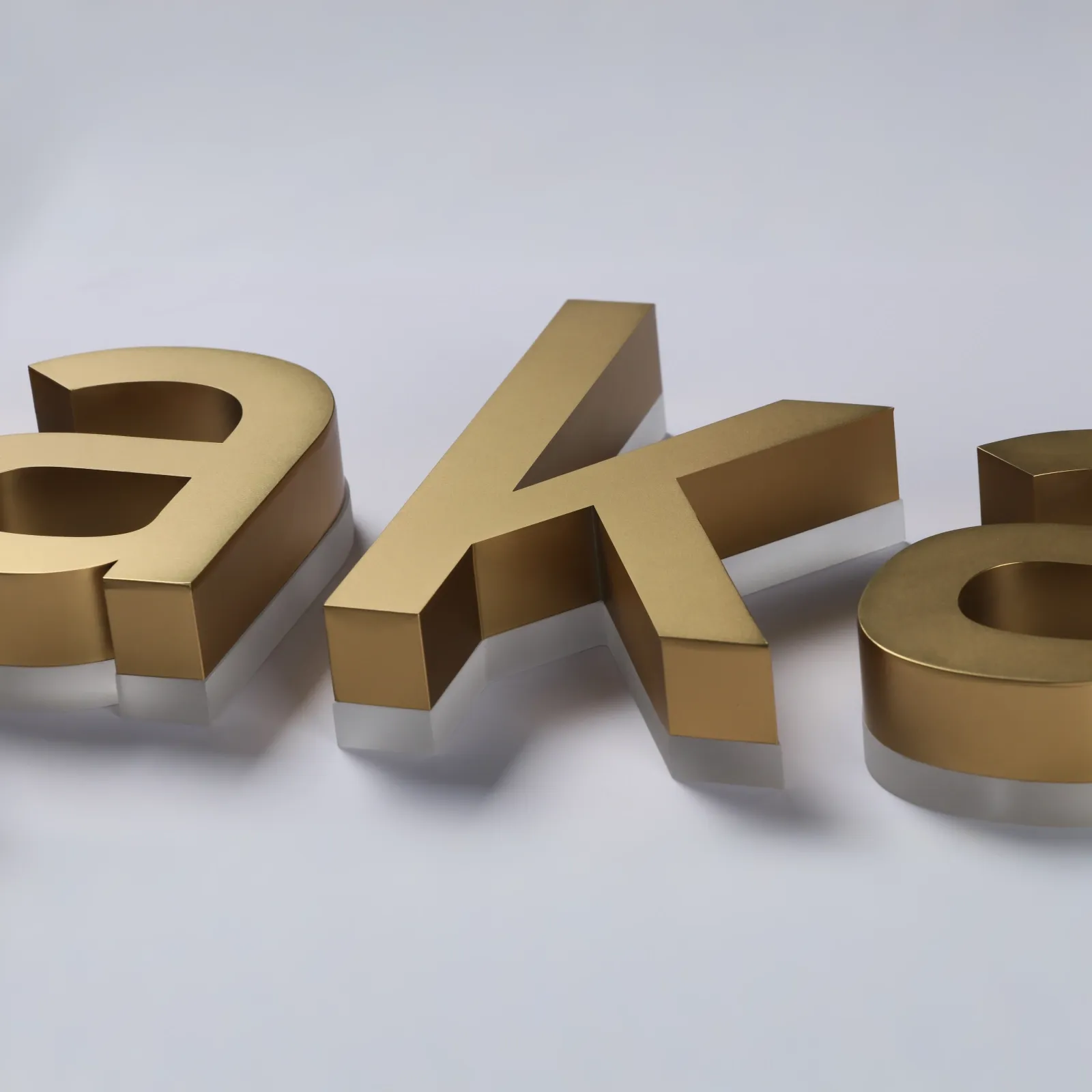 Custom Satin Titanium Gold Backlit Letters — Halo Lit Channel Sign with Frosted Clear Acrylic