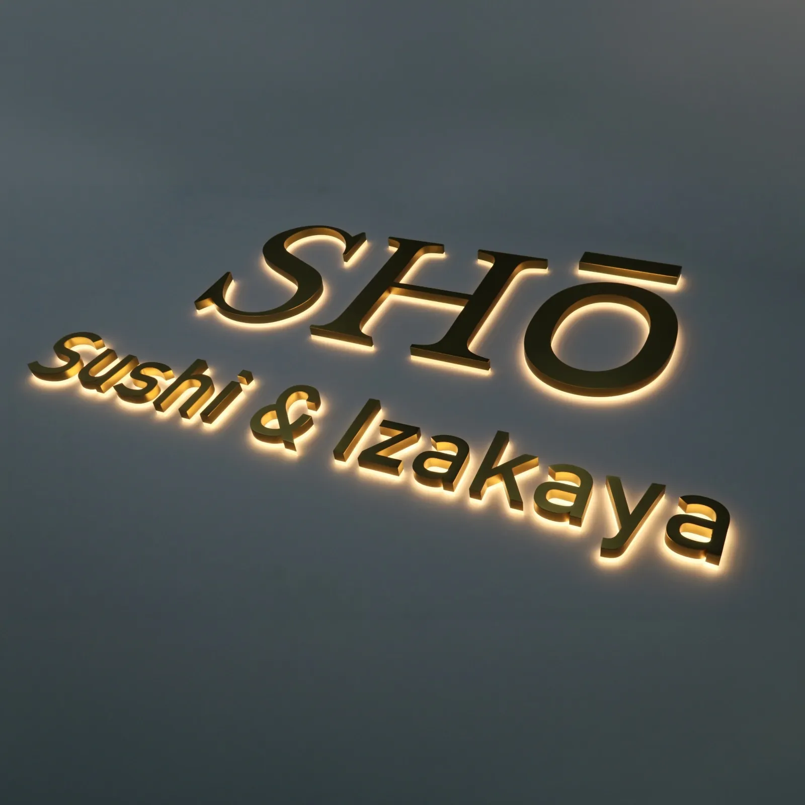 Custom Satin Titanium Gold Backlit Letters — Halo Lit Channel Sign with Frosted Clear Acrylic