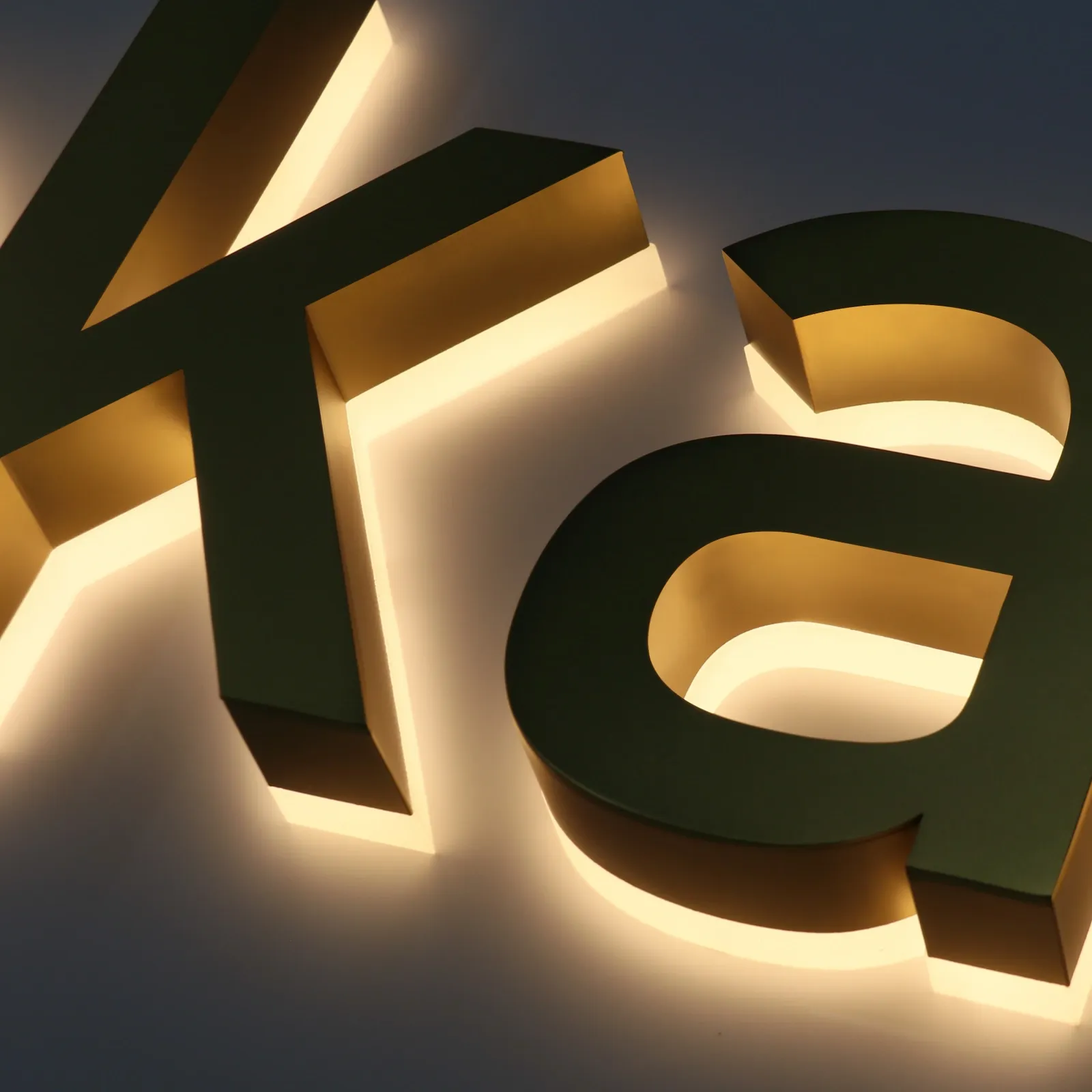 Custom Satin Titanium Gold Backlit Letters — Halo Lit Channel Sign with Frosted Clear Acrylic