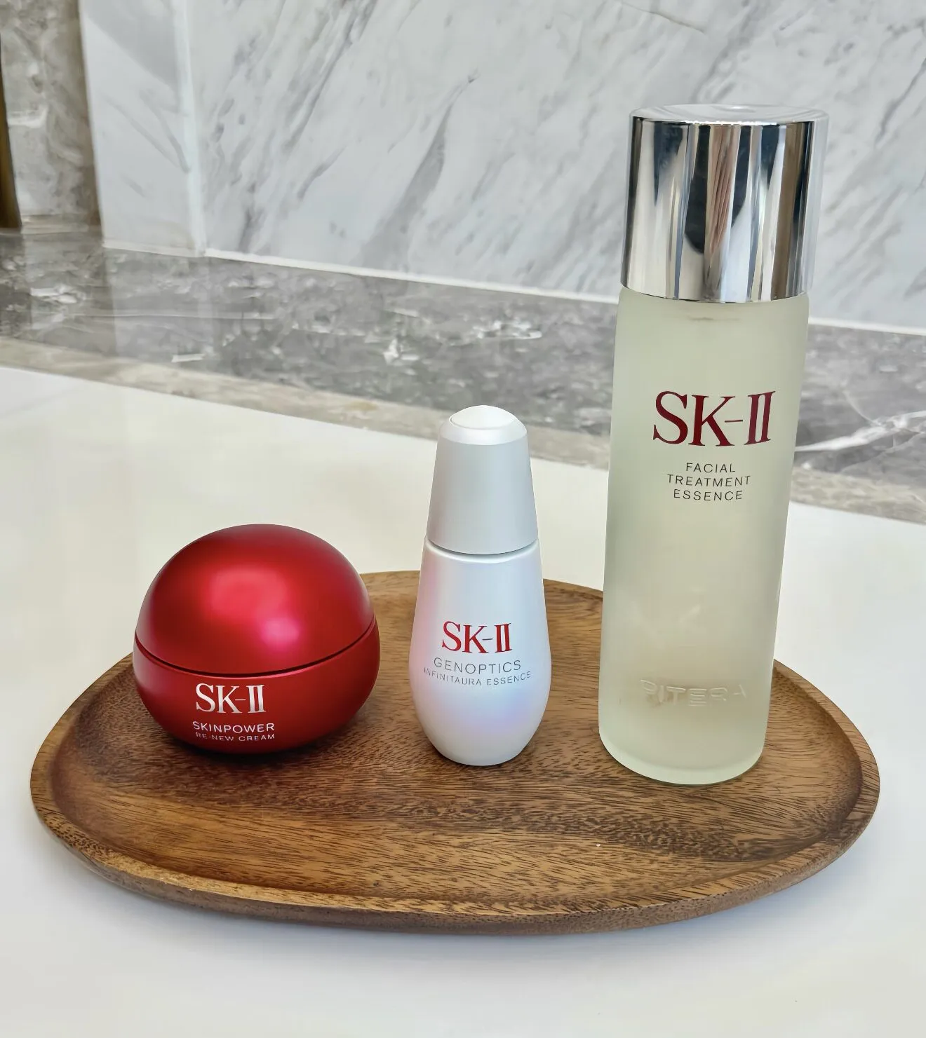 SK-II 3-Piece Skincare Set: Facial Treatment Essence, Genoptics InfinitAura Essence, and Skinpower Re-New Cream for Radiant, Youthful Skin